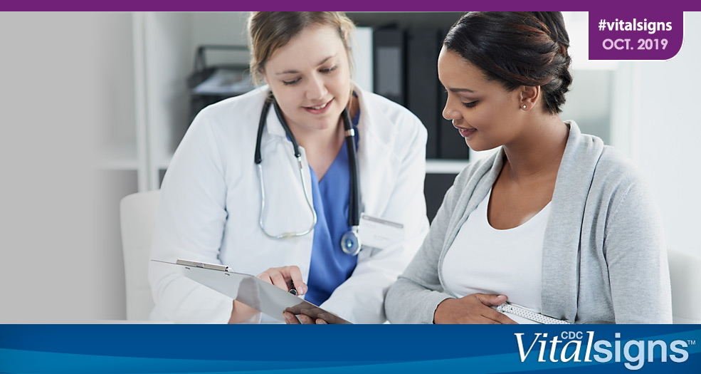 Vaccinating Pregnant Women Doctor going over results with a pregnant patient