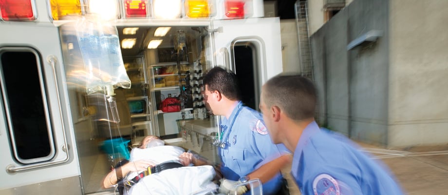 Paramedics with patient in an ambulance