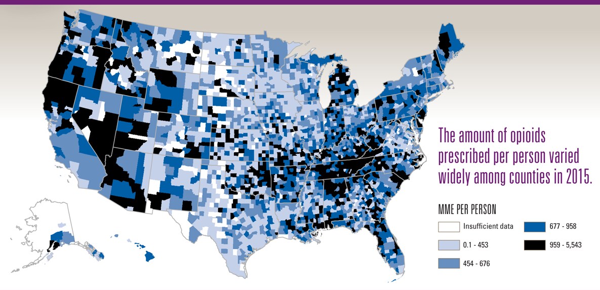 Graphic is a map of the United States, showing the amount of opioids prescribed per person by county. Amounts vary across the country, with many of the highest prescribing counties in Appalachia and parts of the Western United States