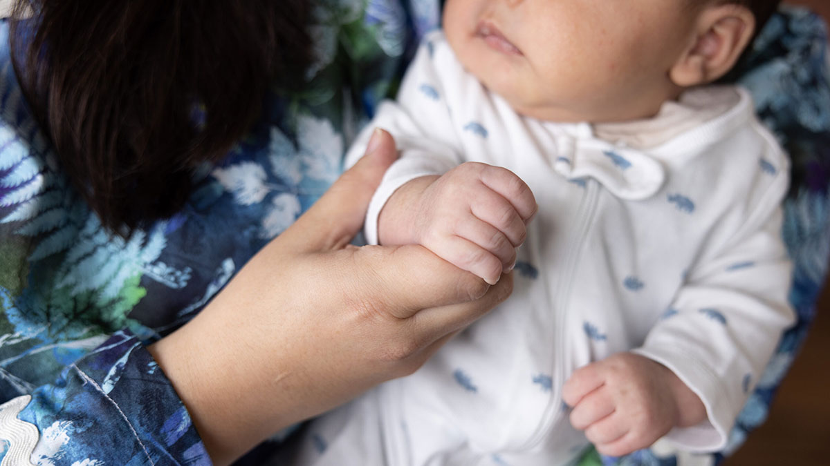 A mother in Bethel, Alaska holding her infant