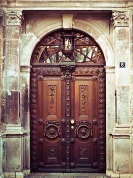 close-up of ornately carved wooden doors