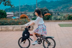 Example image: young girl on bicycle