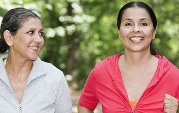 Two women jogging together.