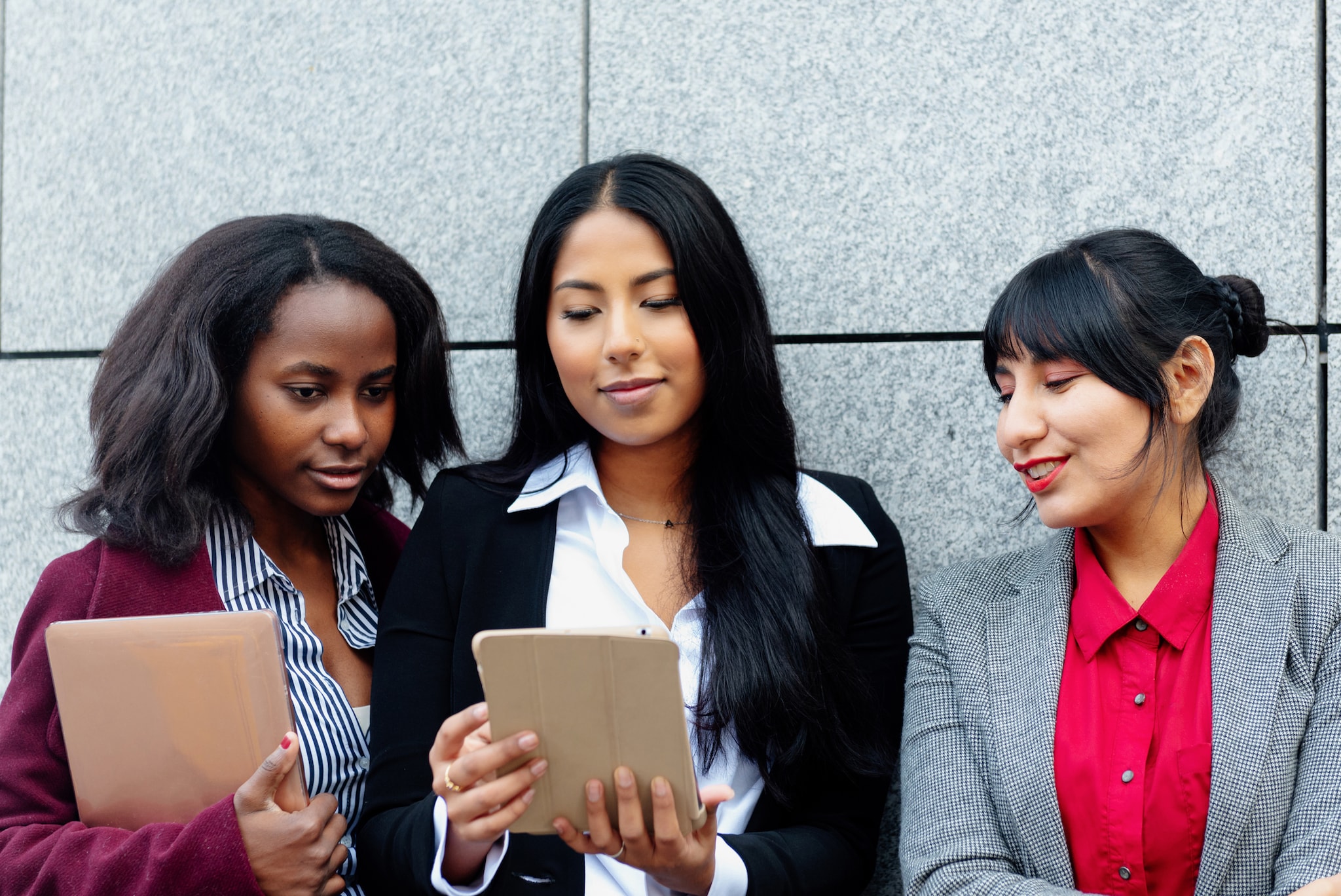 three multiracial businesswomen