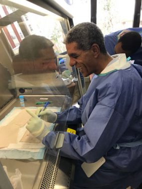 Microbiologist working at the fume hood during training in the rabies laboratory at the Ethiopian Public Health Institute in Addis Ababa, Ethiopia.