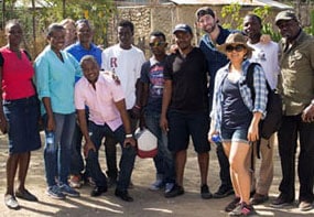 EIS officer Cuc Tran (third from the right) and OC Hurbert fellow Maxwell Kligerman (behind her) with the team in Haiti.