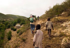 Typical Haitian countryside. Team of educators hiking to reach remote villages.