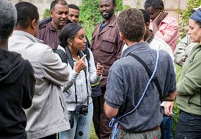 CDC’s Meseret Birhane (center) explains in the local Amharic language how the team can work together to vaccinate dogs in a community.