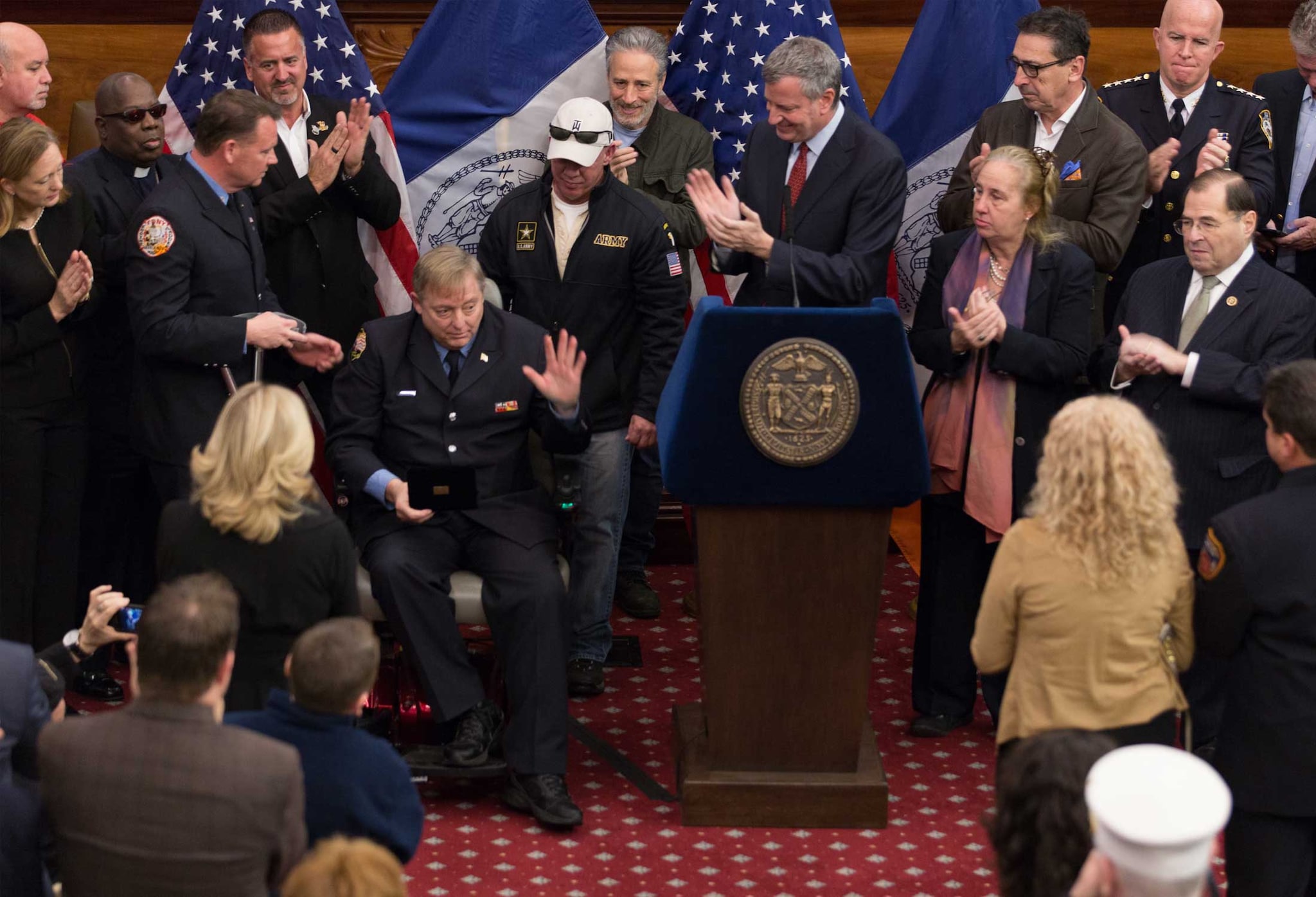 New York City Mayor Bill de Blasio hosts a celebration in January 2016 honoring the efforts of first responders, survivors, advocates, and lawmakers to reauthorize the Zadroga Act.