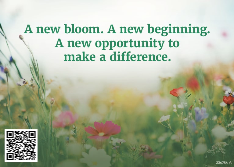 A green meadow with a variety of different colored flowers with text that reads: " A new bloom. A new beginning. A new opportunity to make a difference."