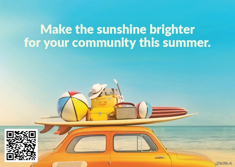 An orange car with a surfboard, beach ball, hat, umbrella, guitar and luggage by the beach with text that reads: "Make the sunshine brighter for your community this summer."