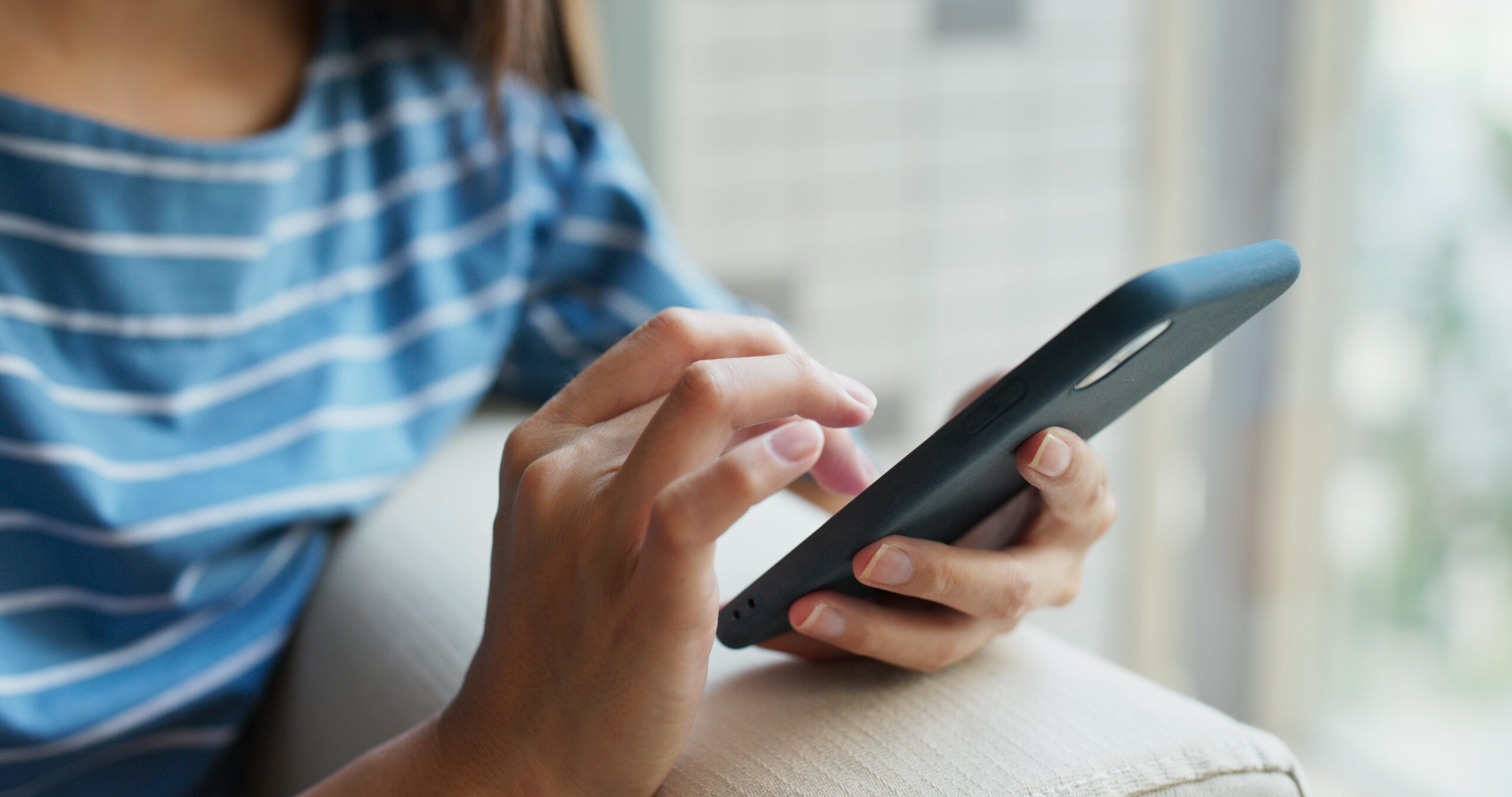 A high school student on her cellphone.