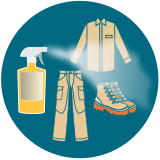 clothing and gear being sprayed with insect repellent