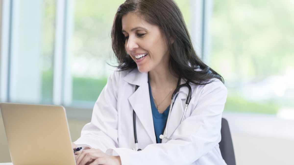 Photo of a nurse using a laptop