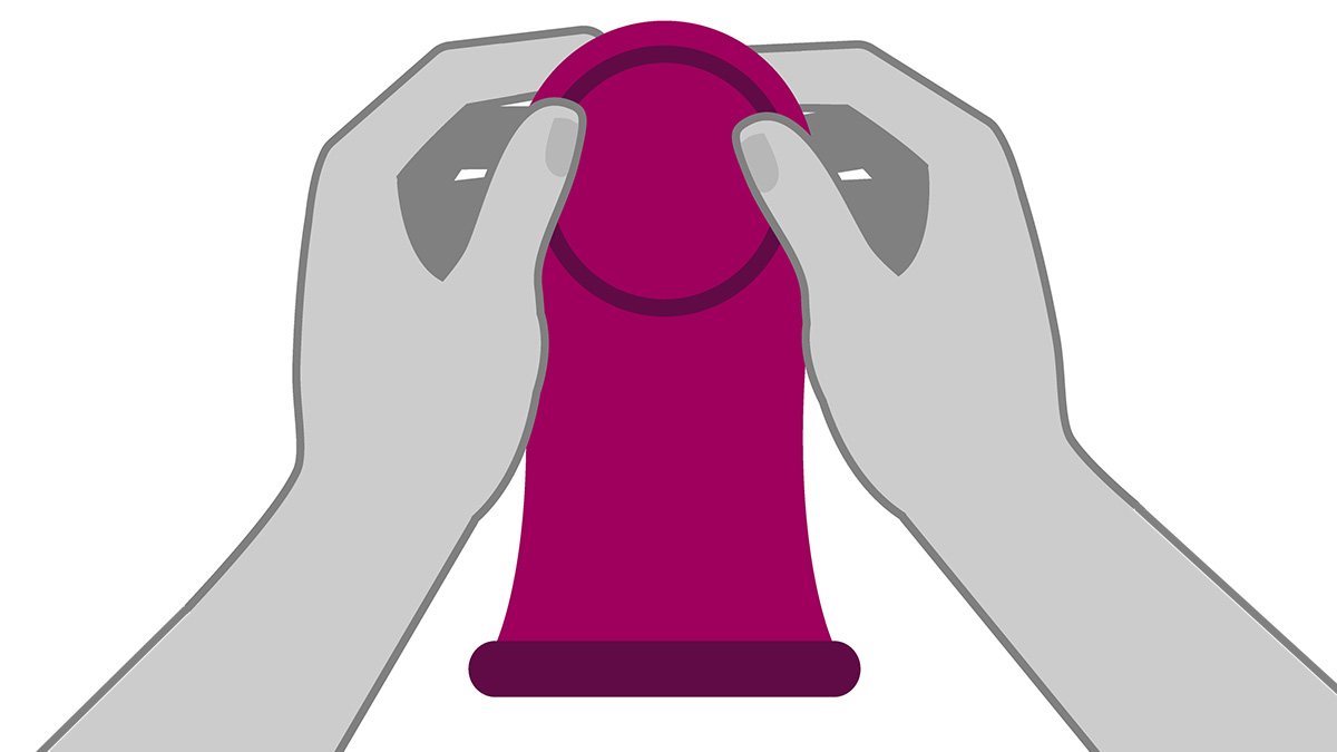 Hands holding a female (internal) condom Hands holding a female (internal) condom.