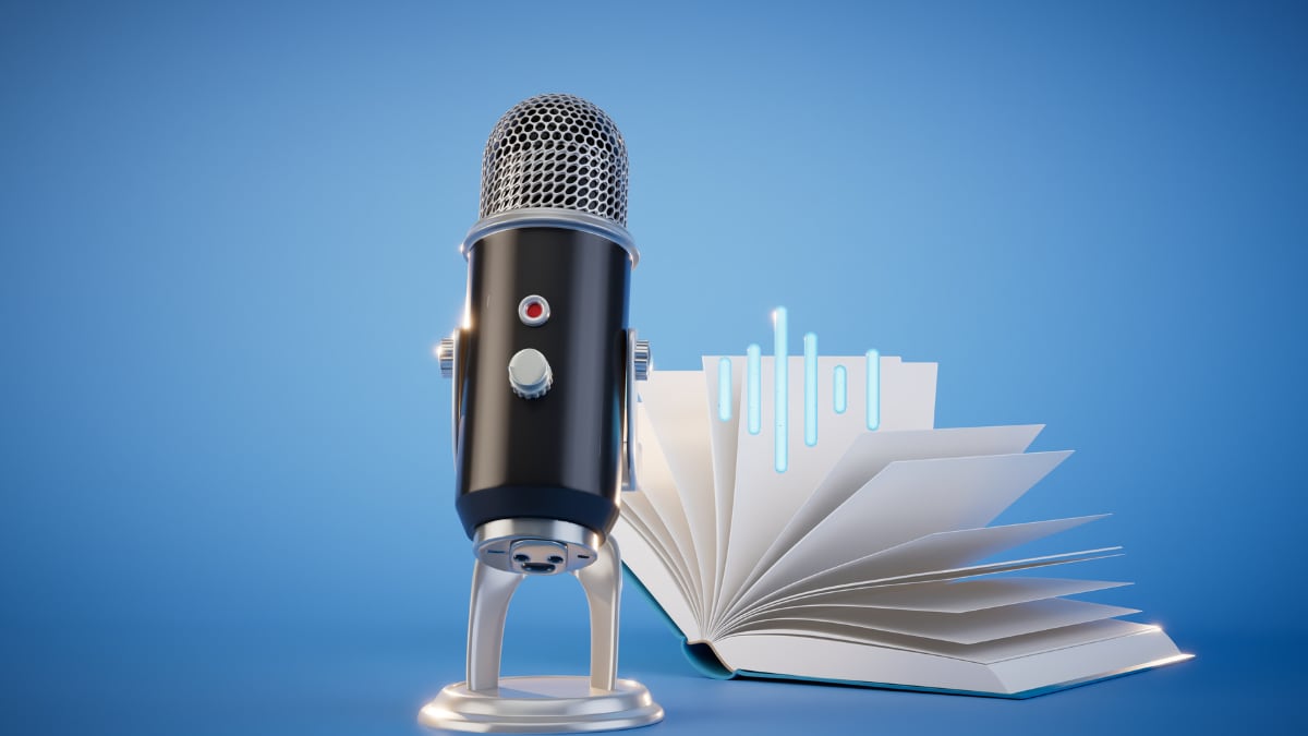 A microphone and an open book on a blue background