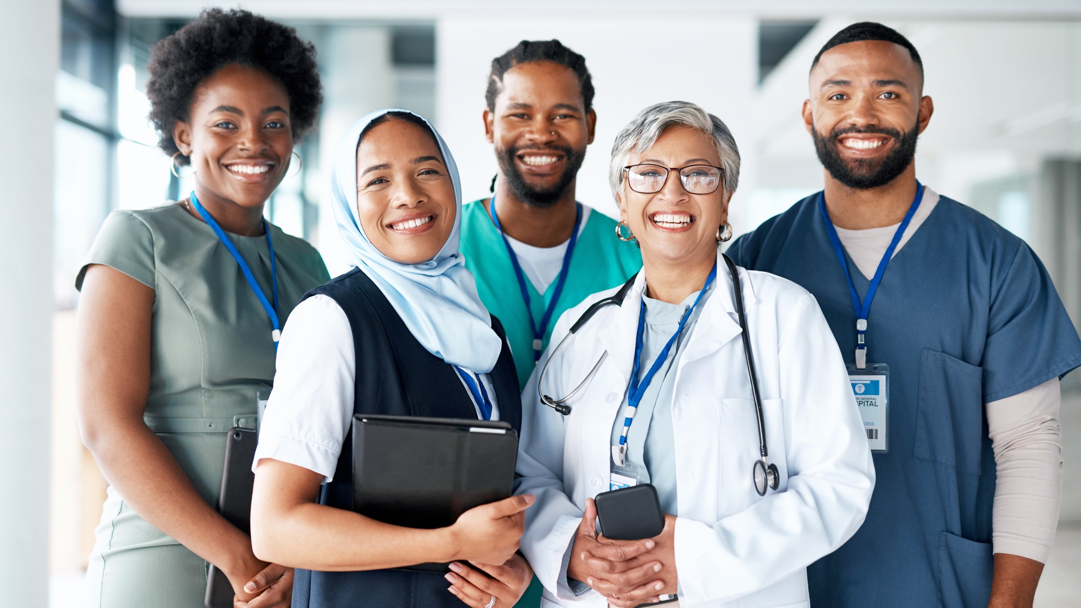 Clinicians A diverse group of healthcare providers standing together, representing different ages, races, and ethnicities.