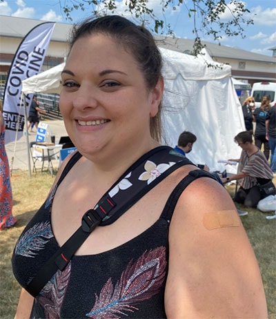 Wisconsin resident shows her vaccine bandage