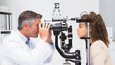 young woman getting eye exam